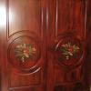 Faux painted mahogany on fiberglass doors. Handpainted tropical floral spray with an antique, aged finish.