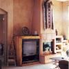"Wood grained" drywall entertainment built-in with plater finish chimney and color washed walls.  New River, Arizona