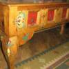 Painted mexican furniture with wax overcoat.Bright design painted on desktop