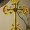 Refinished and hand-painted metal cross wall decor.